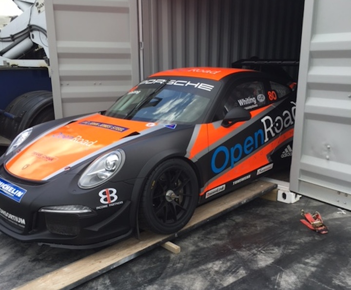 Porsche race car secured inside a shipping container for motorsport transport